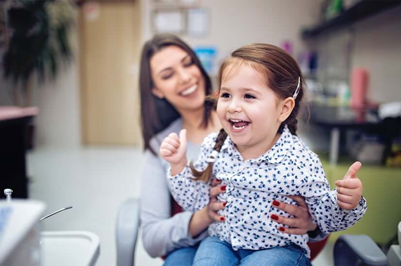 mother holding her young daughter